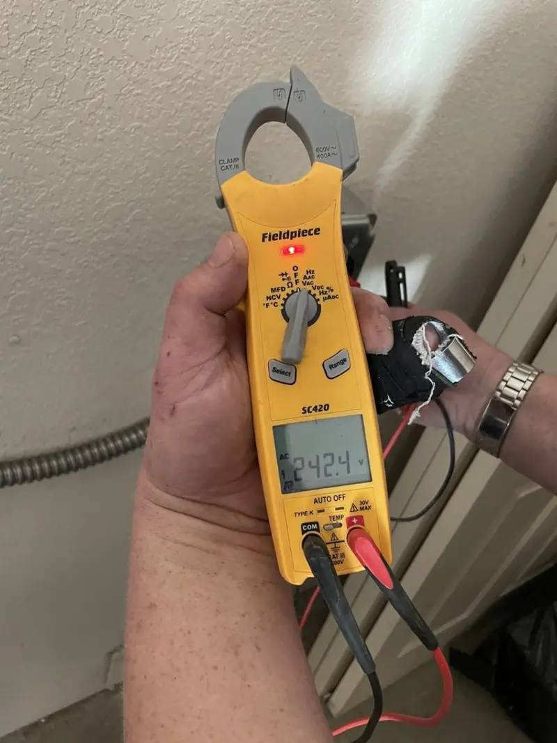Voltage testing with clamp meter during Circuit Breaker Repair in Boone